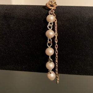 Golden chain and pearly bracelet